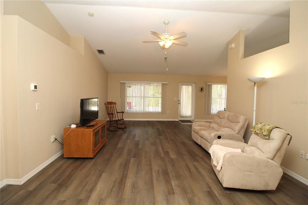 7432 Perennial Road North Port, FL 34291 - Photo 14 of 61 a living room with furniture and a large window
