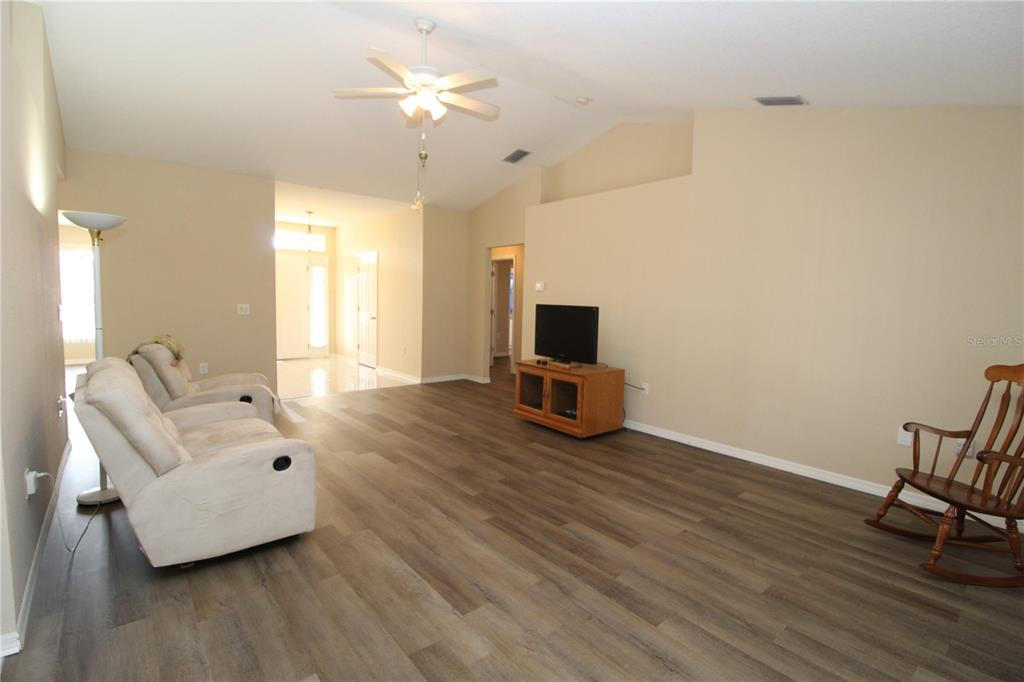 7432 Perennial Road North Port, FL 34291 - Photo 17 of 61 a living room with furniture and a flat screen tv
