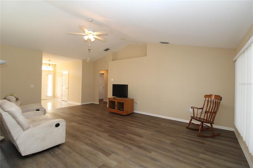 7432 Perennial Road North Port, FL 34291 - Photo 18 of 61 a living room with furniture and a flat screen tv