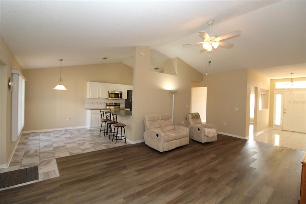 7432 Perennial Road North Port, FL 34291 - Photo 19 of 61 a living room with furniture and wooden floor