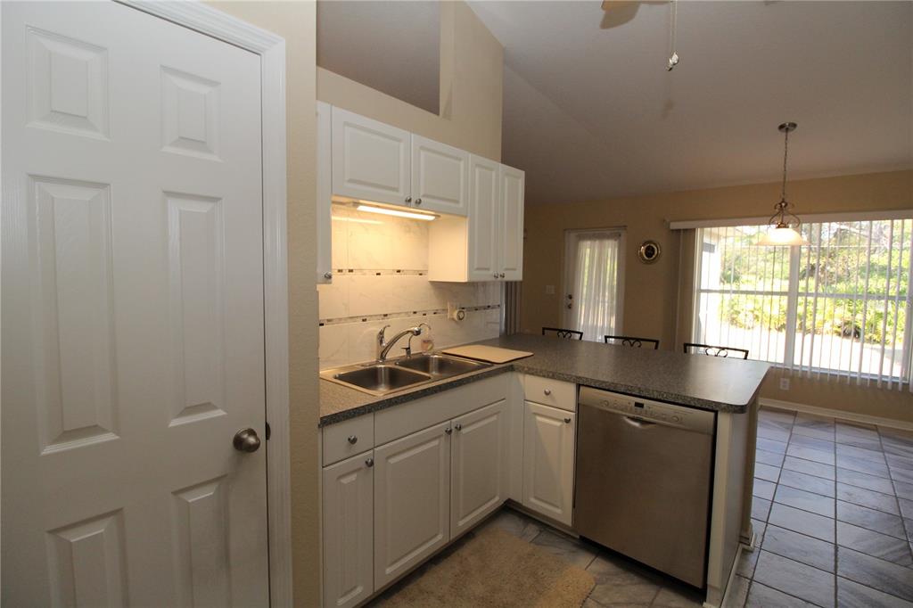 7432 Perennial Road North Port, FL 34291 - Photo 26 of 61 a kitchen with sink and cabinets