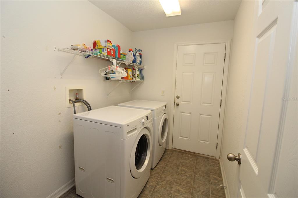7432 Perennial Road North Port, FL 34291 - Photo 29 of 61 a utility room with dryer and washer
