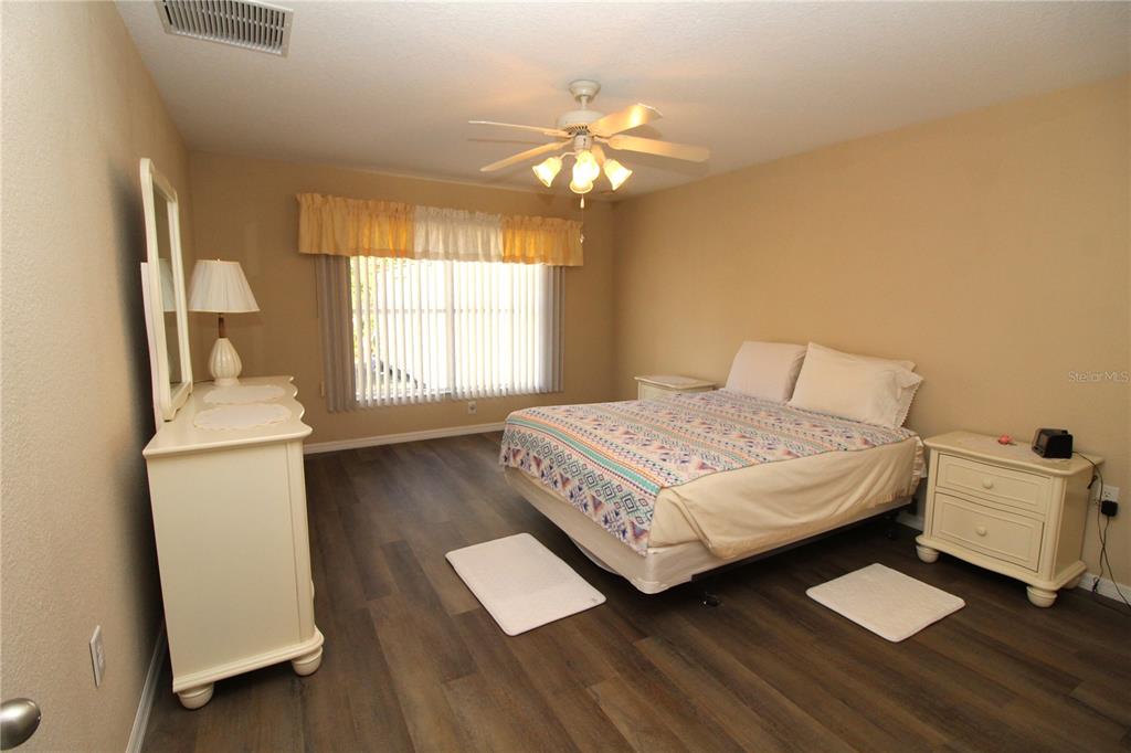 7432 Perennial Road North Port, FL 34291 - Photo 30 of 61 a bedroom with a bed and a window