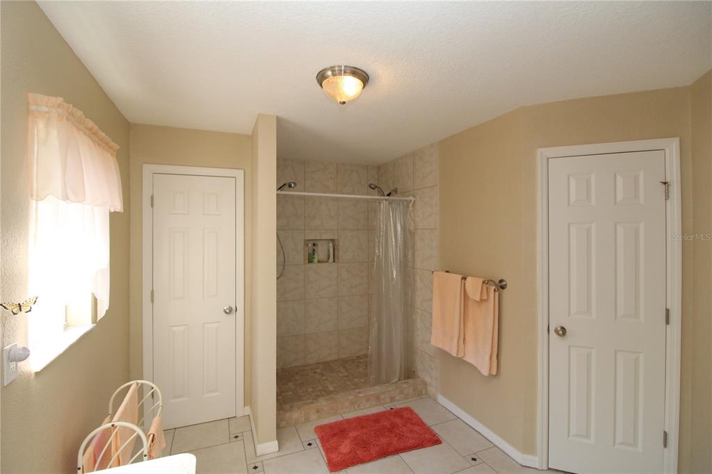 7432 Perennial Road North Port, FL 34291 - Photo 34 of 61 a bathroom with a shower and a sink