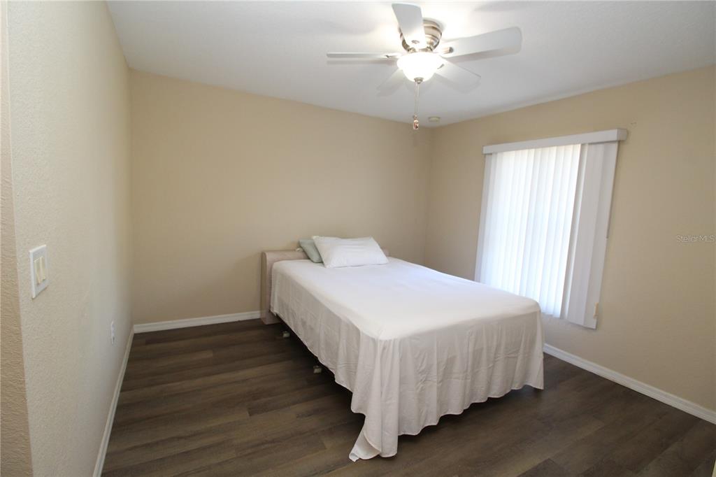 7432 Perennial Road North Port, FL 34291 - Photo 38 of 61 a bedroom with a bed and a window