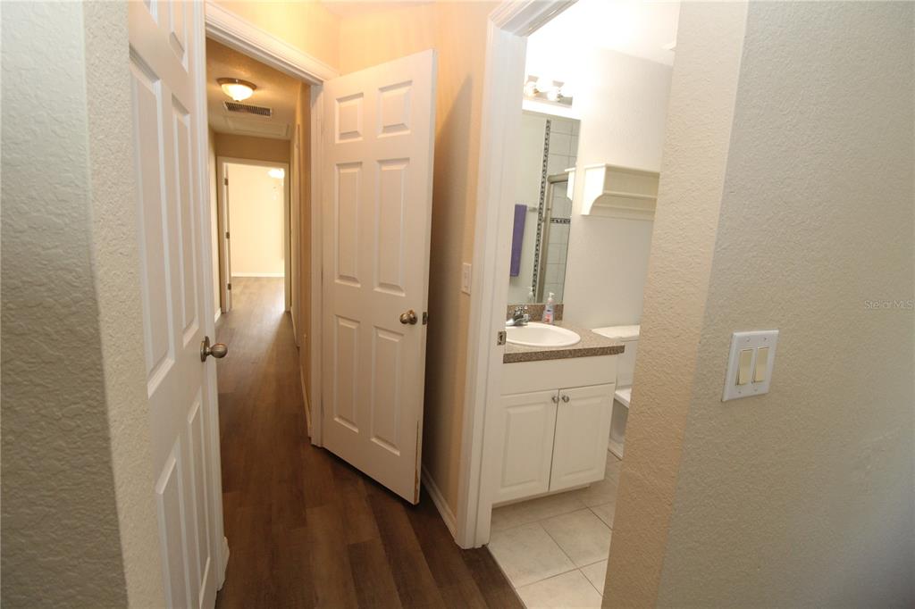 7432 Perennial Road North Port, FL 34291 - Photo 40 of 61 a bathroom with a sink and a mirror