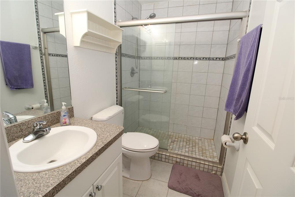 7432 Perennial Road North Port, FL 34291 - Photo 41 of 61 a bathroom with a sink toilet and shower