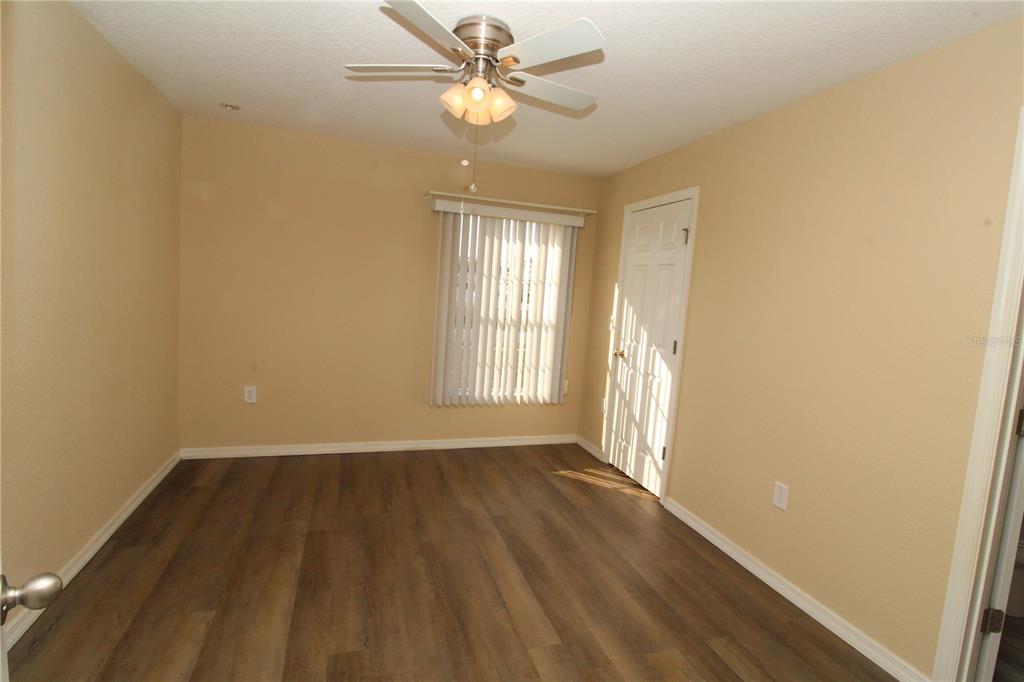 7432 Perennial Road North Port, FL 34291 - Photo 42 of 61 wooden floor in an empty room with a window