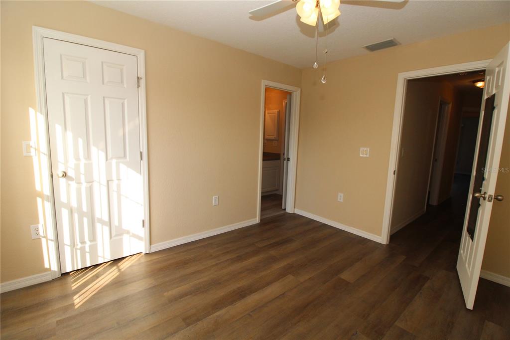 7432 Perennial Road North Port, FL 34291 - Photo 43 of 61 wooden floor in an empty room with a window