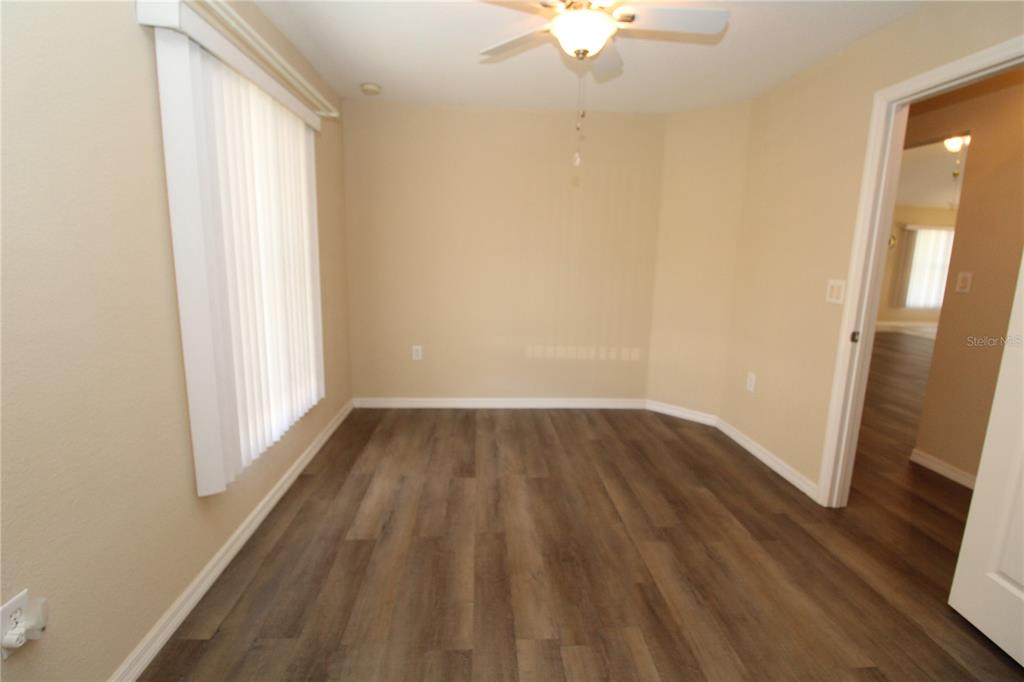 7432 Perennial Road North Port, FL 34291 - Photo 46 of 61 wooden floor in an empty room with a window
