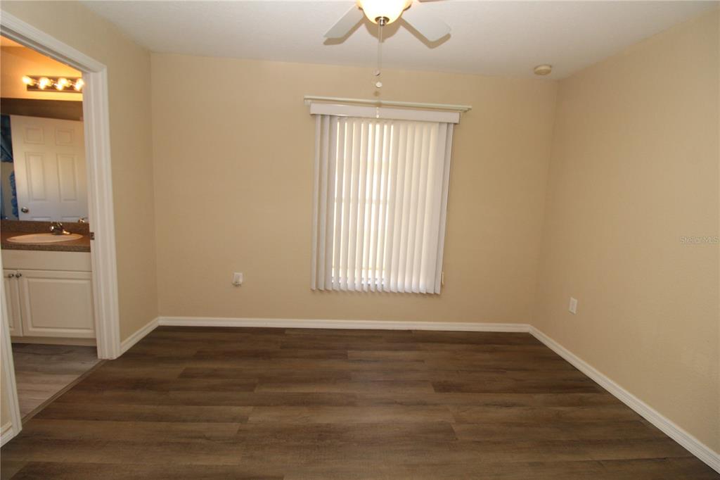 7432 Perennial Road North Port, FL 34291 - Photo 47 of 61 a view of an empty room with wooden floor and a window