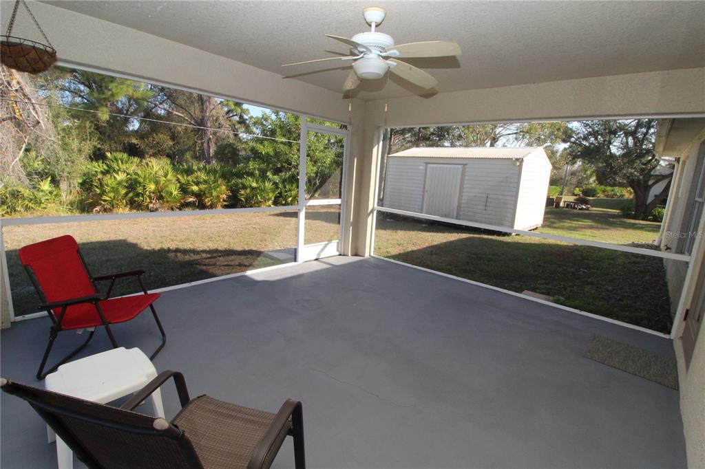 7432 Perennial Road North Port, FL 34291 - Photo 51 of 61 a living room with furniture and a large window