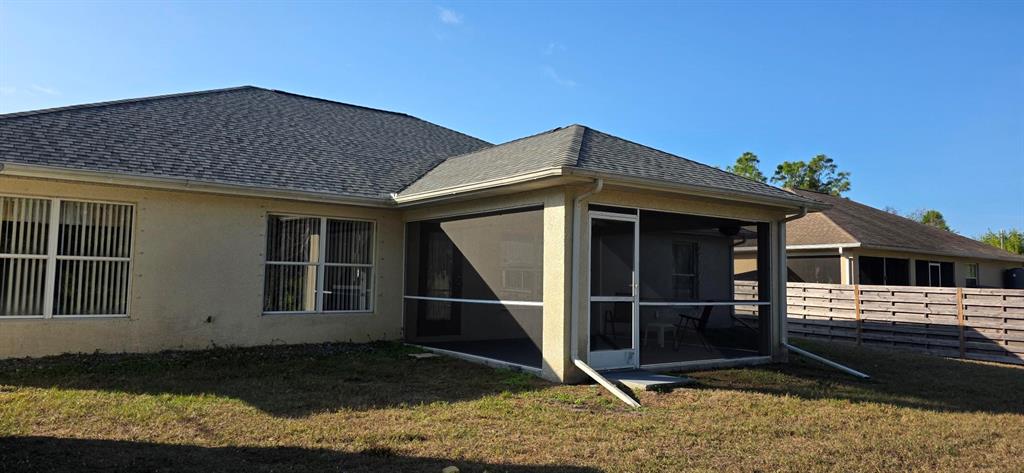 7432 Perennial Road North Port, FL 34291 - Photo 55 of 61 a front view of a house with a yard