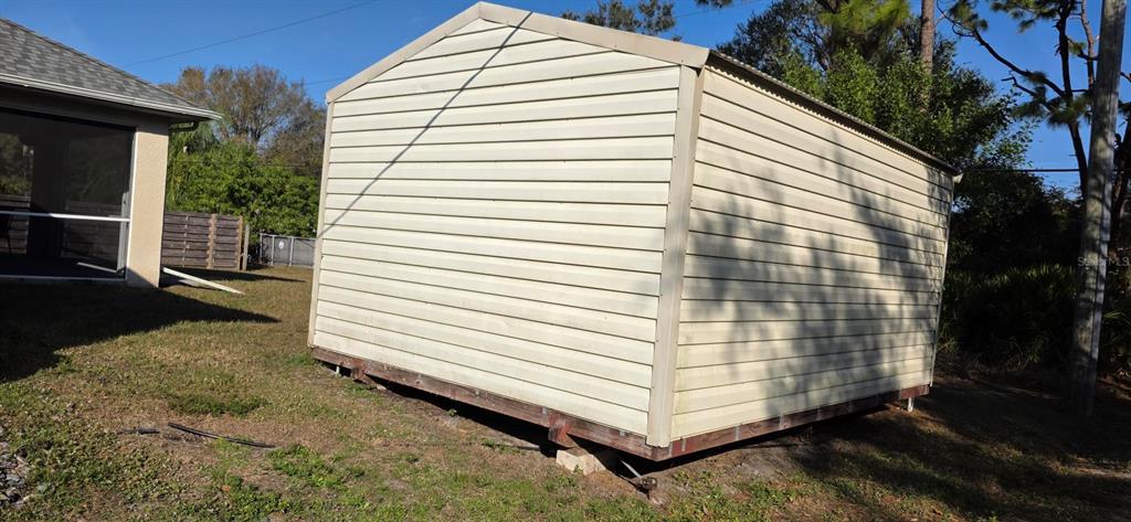 7432 Perennial Road North Port, FL 34291 - Photo 56 of 61 a view of a white house with a yard and balcony