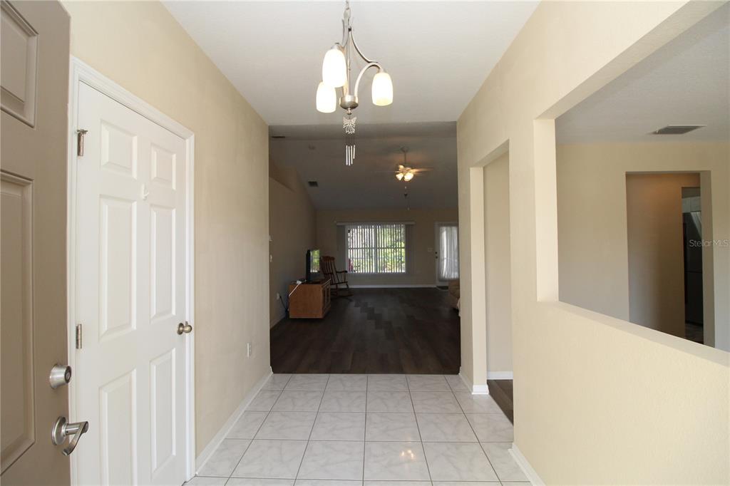 7432 Perennial Road North Port, FL 34291 - Photo 10 of 61 a view of a hallway to a livingroom with furniture