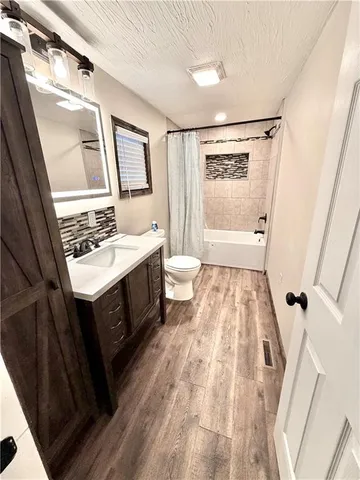 a bathroom with a sink a mirror and a vanity