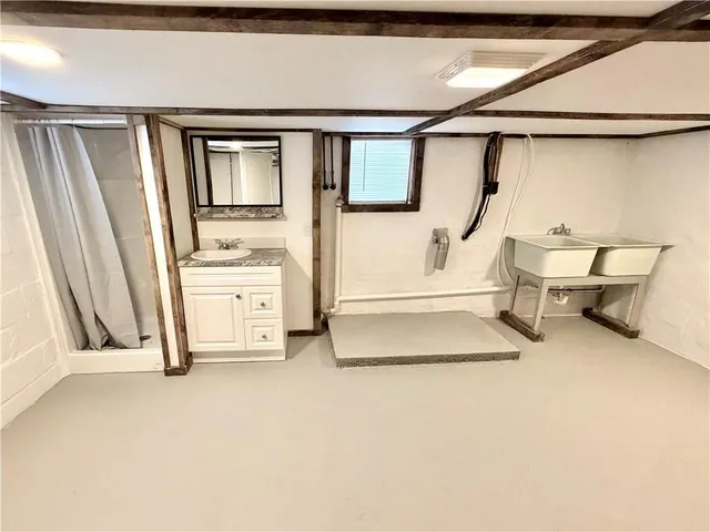 a bathroom with a double vanity sink and mirror