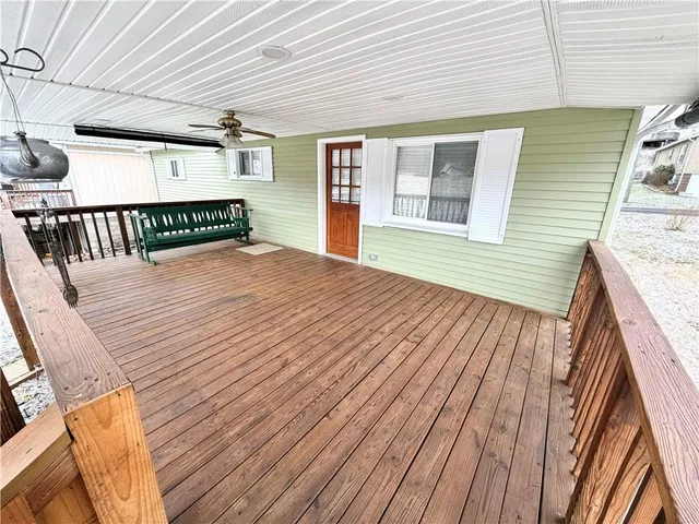 a balcony with wooden floor