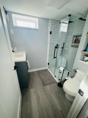 view of a room with wooden floor and windows