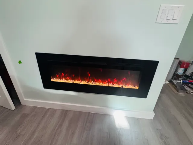 a view of a kitchen with fridge and workspace
