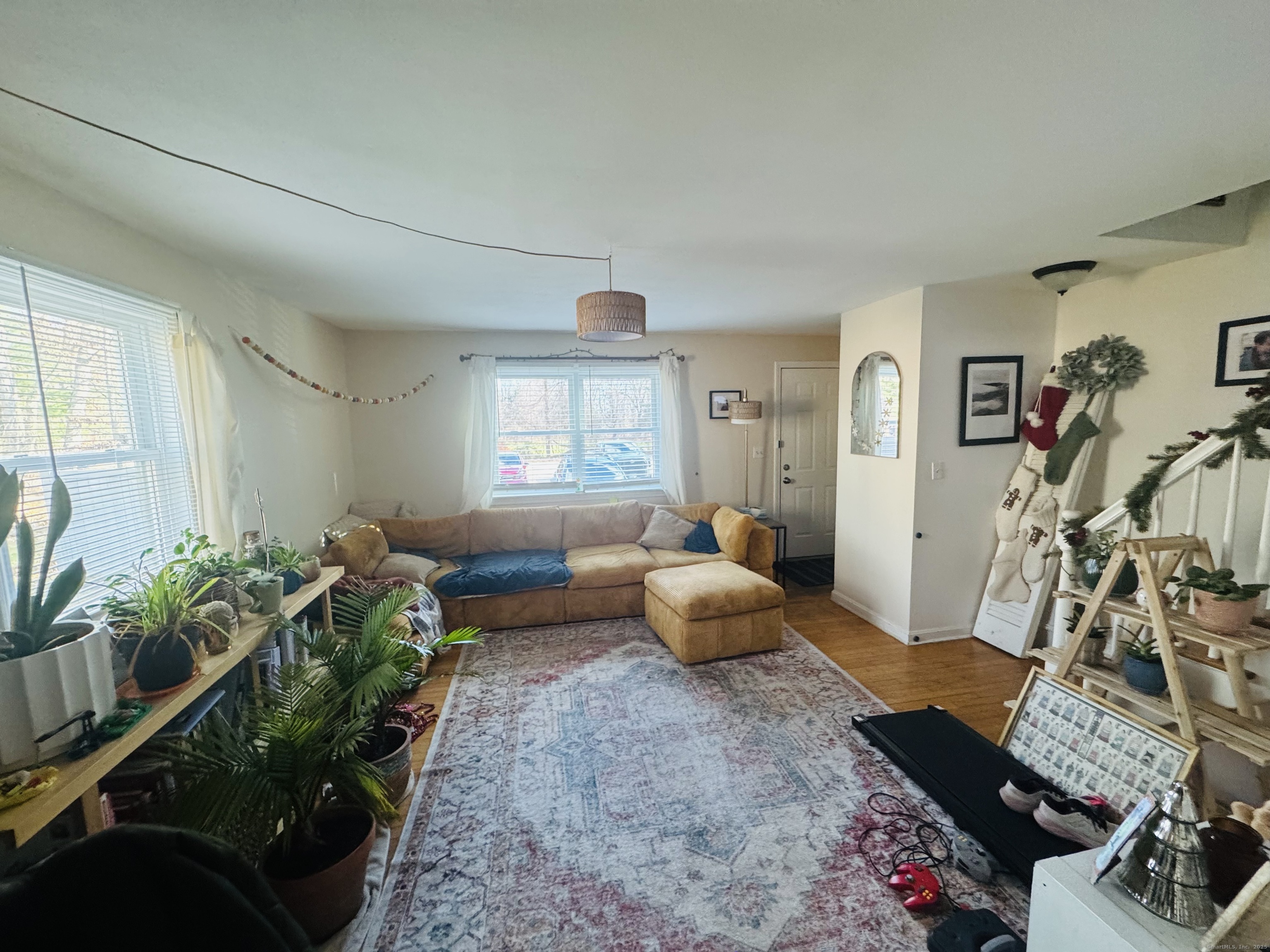 205 Ballamahack Road Windham, CT 06280 - Photo 20 of 29 a living room with furniture and a potted plant