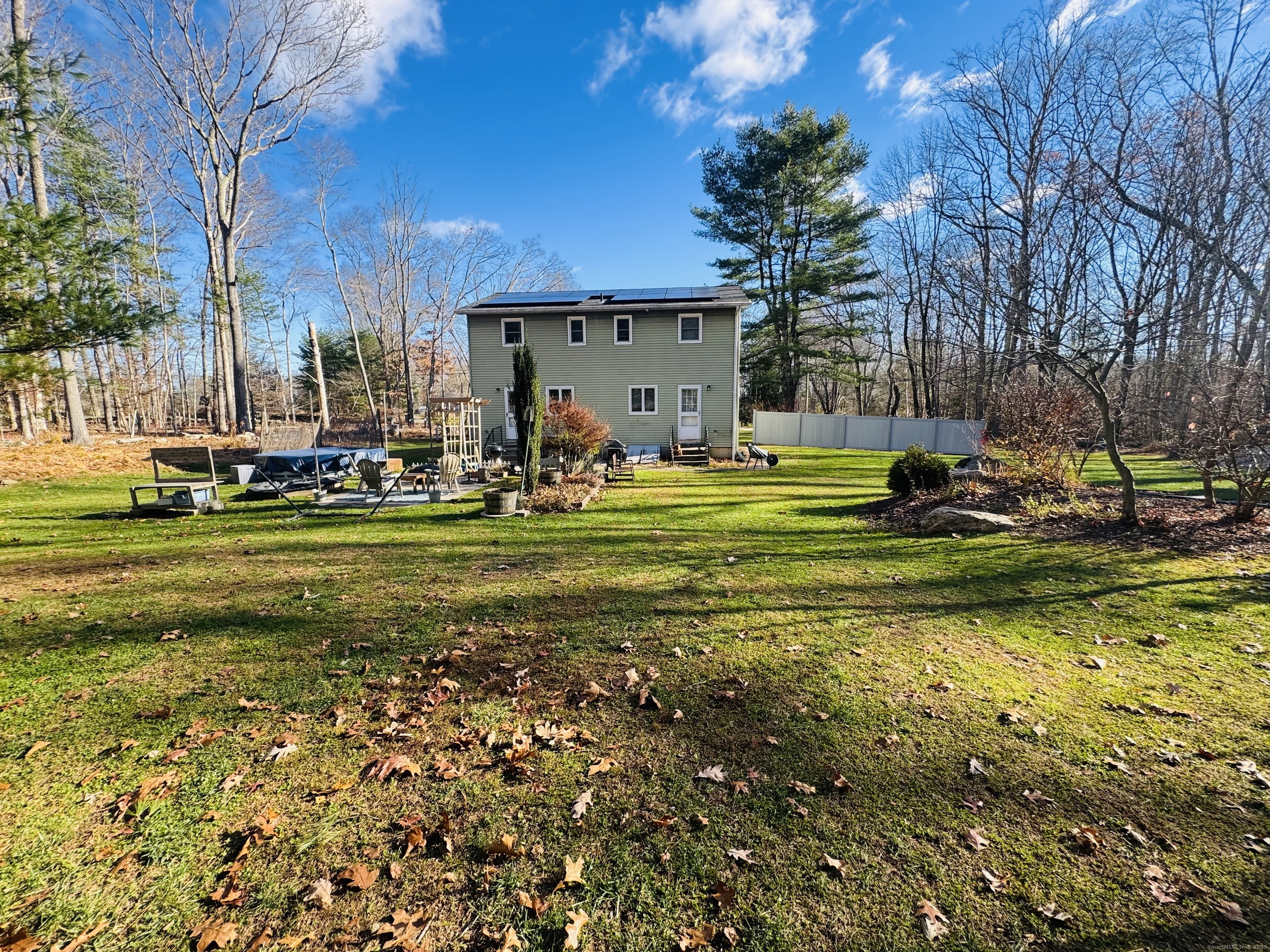 205 Ballamahack Road Windham, CT 06280 - Photo 2 of 29 a view of a patio with a table and chairs and potted plants