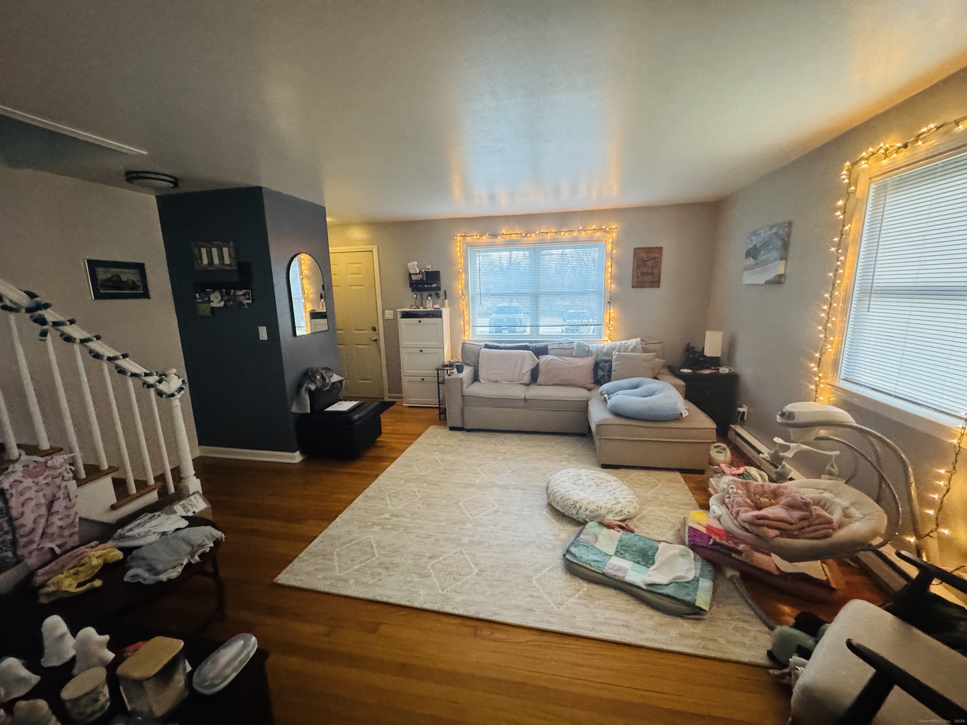 205 Ballamahack Road Windham, CT 06280 - Photo 10 of 29 a living room with furniture and a wooden floor