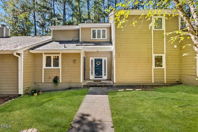 a front view of a house with a yard