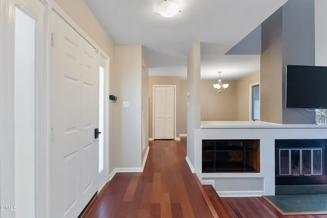 a living room with couch and a hard wood floor