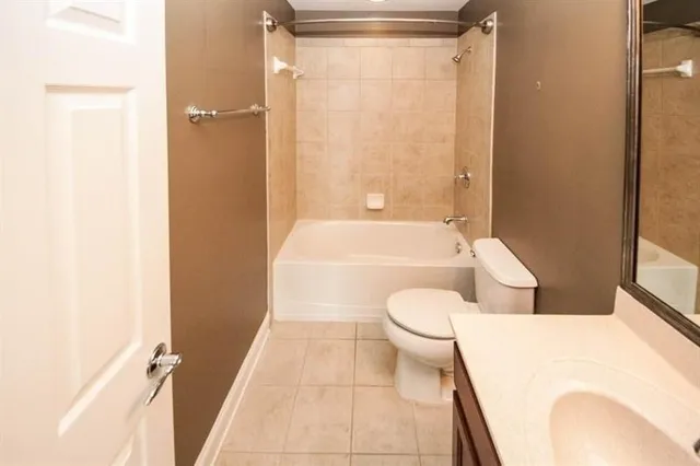 a bathroom with a toilet and a bathtub