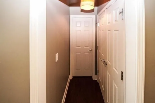 a view of a bathroom from a corridor