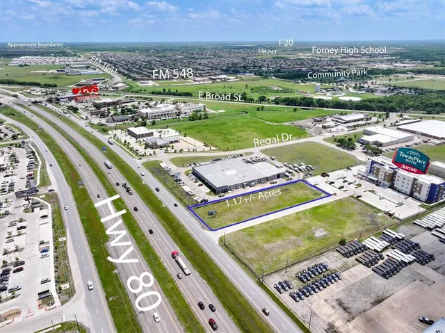 an aerial view of a pool and an outdoor seating
