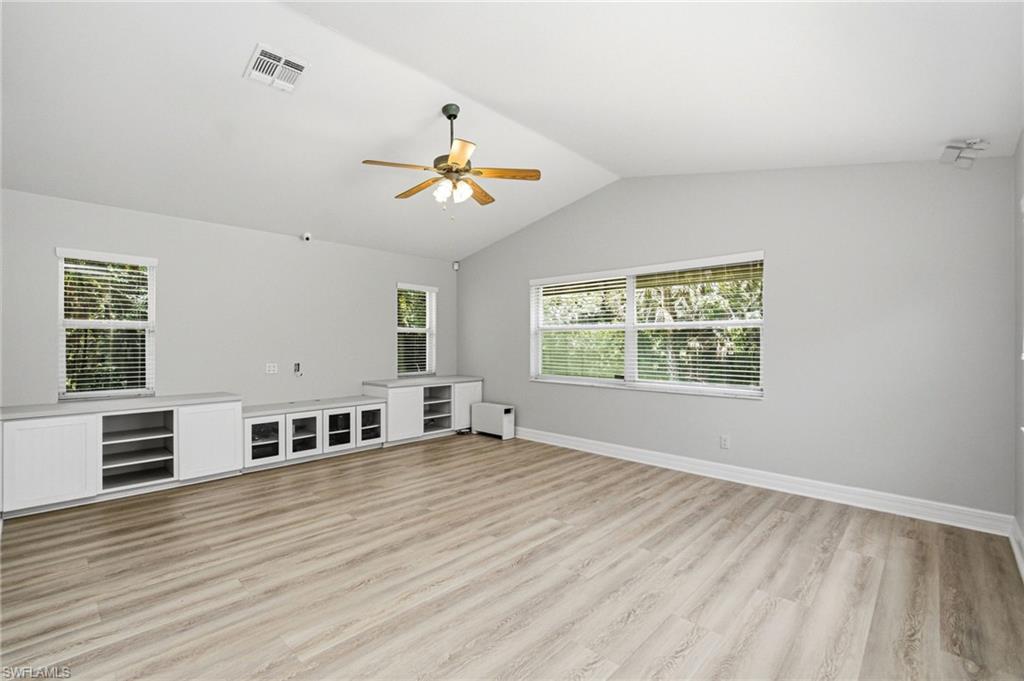 2053 17th Street Southwest Naples, FL 34117 - Photo 13 of 47 wooden floor in an empty room with a window