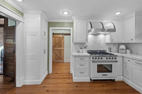 a kitchen with stainless steel appliances a stove and a refrigerator
