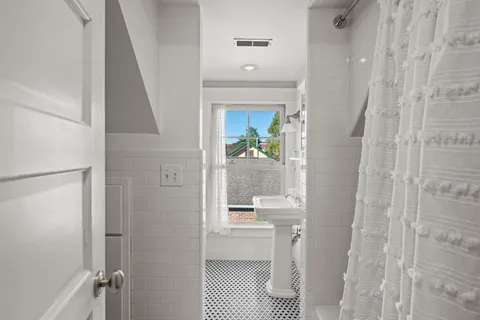 a bathroom with a sink and mirror
