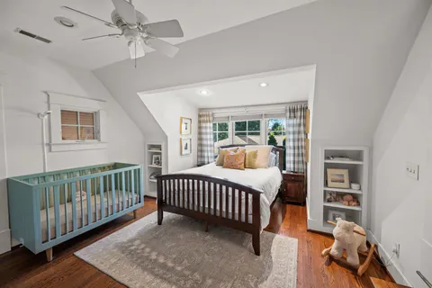 a bedroom with furniture and a window
