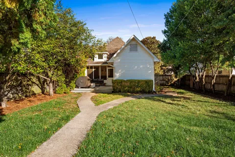 a front view of a house with a yard