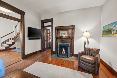 a living room with furniture and a fireplace or television