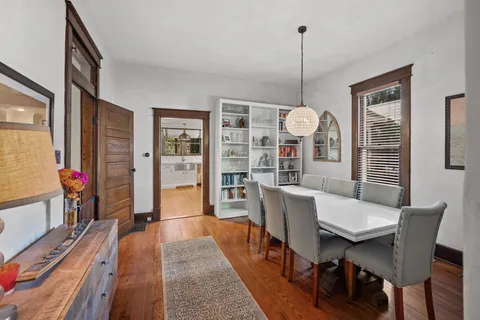 a dining room with furniture and window