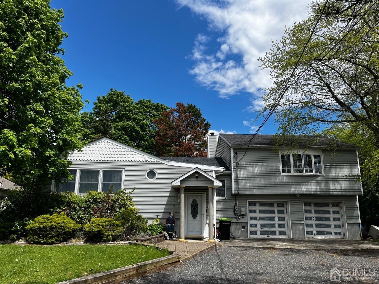 180 Amboy Road Old Bridge, NJ 07747 - Photo 1 of 29 a front view of a house with garden