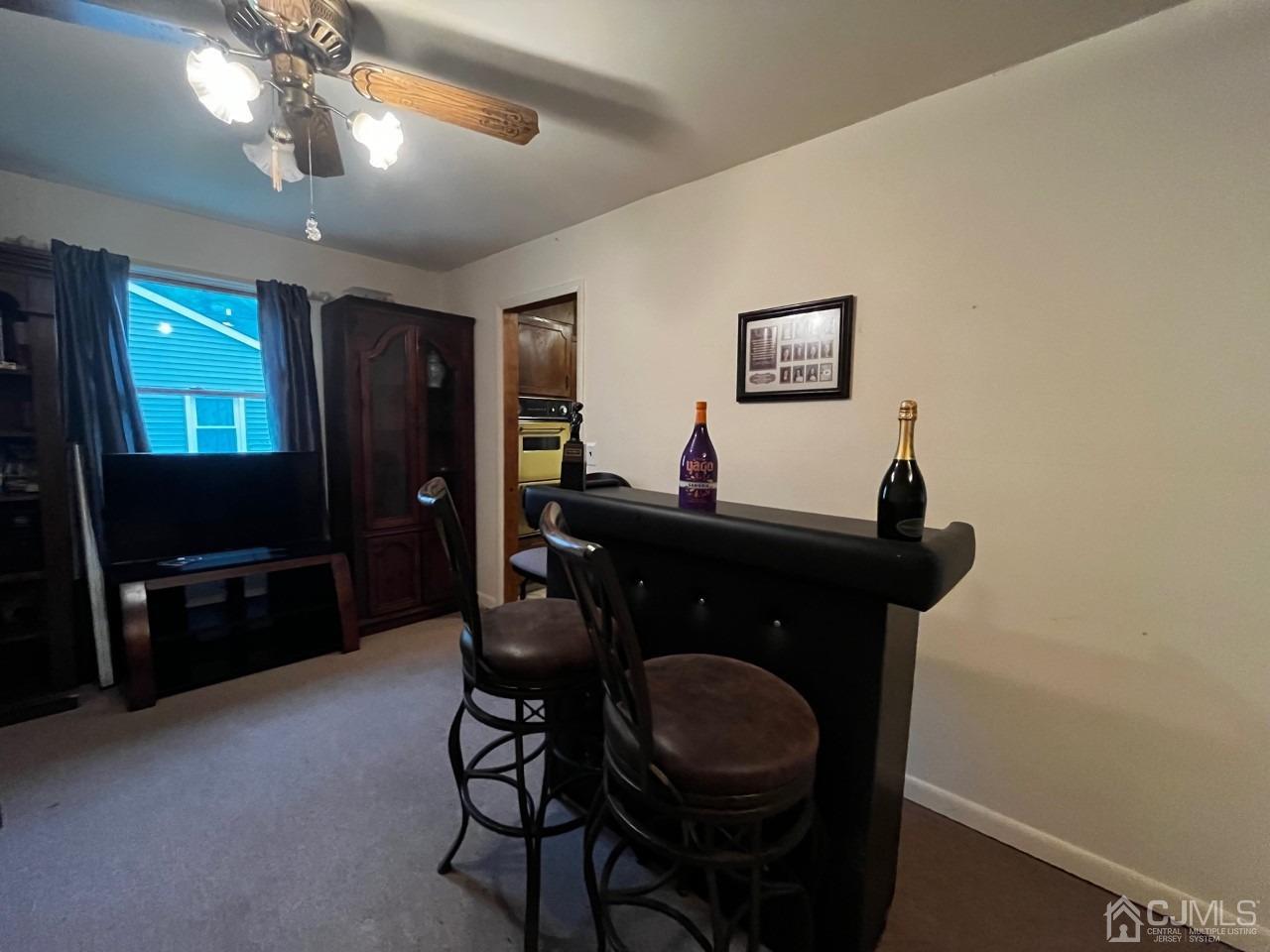 180 Amboy Road Old Bridge, NJ 07747 - Photo 12 of 29 a living room with furniture and a flat screen tv