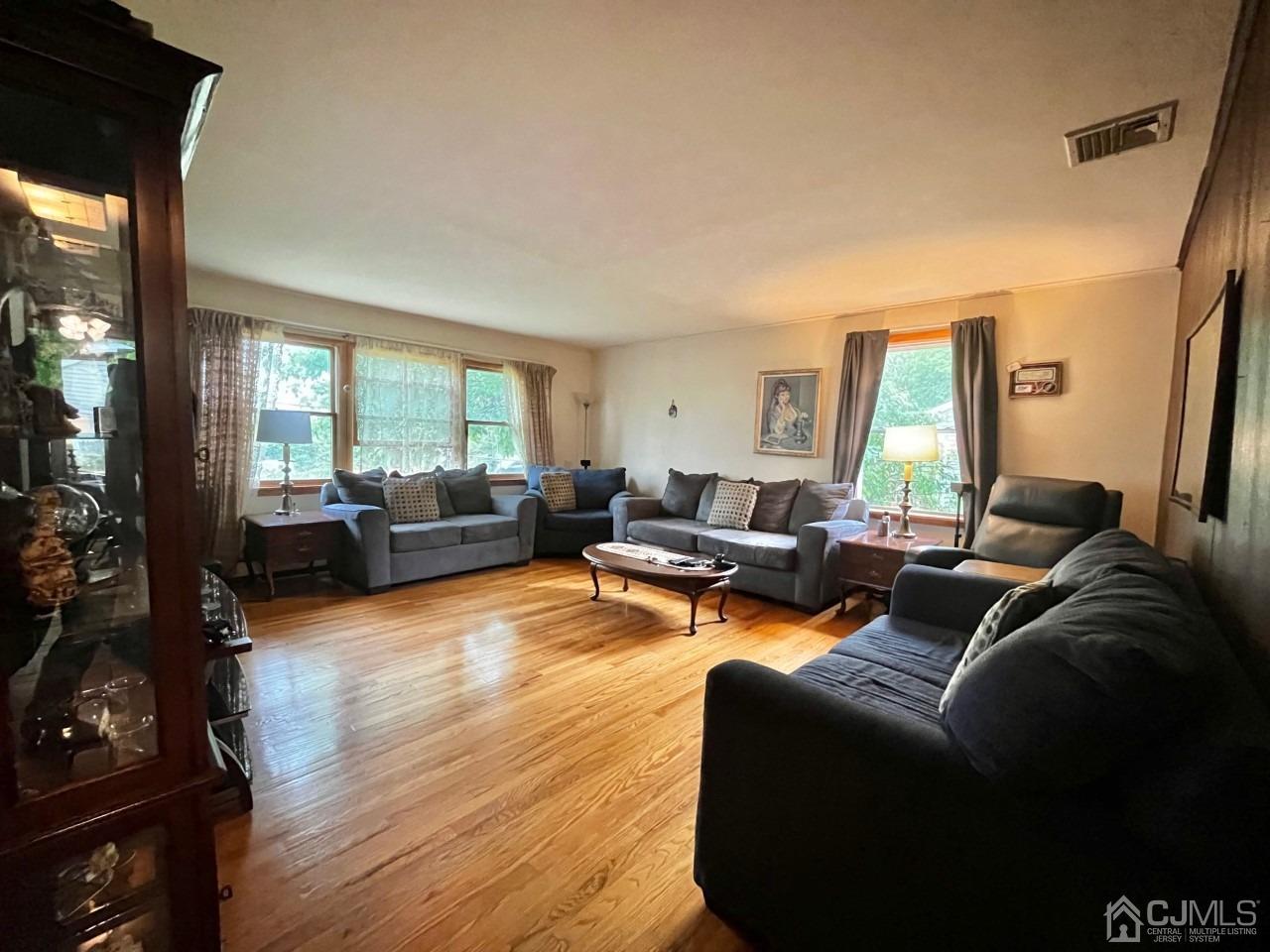 180 Amboy Road Old Bridge, NJ 07747 - Photo 15 of 29 a living room with furniture and a large window