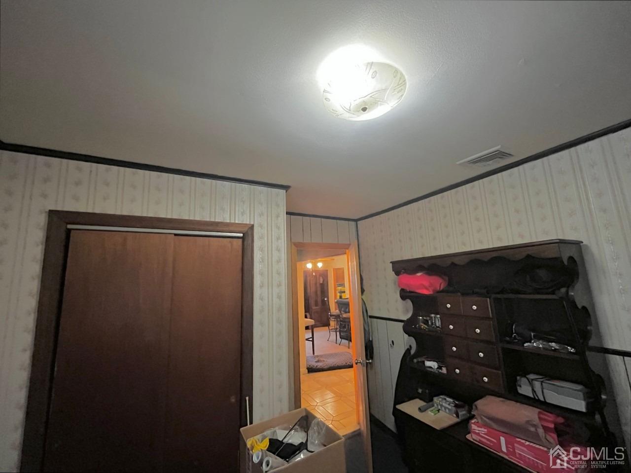 180 Amboy Road Old Bridge, NJ 07747 - Photo 17 of 29 a room with lots of different colored cloths