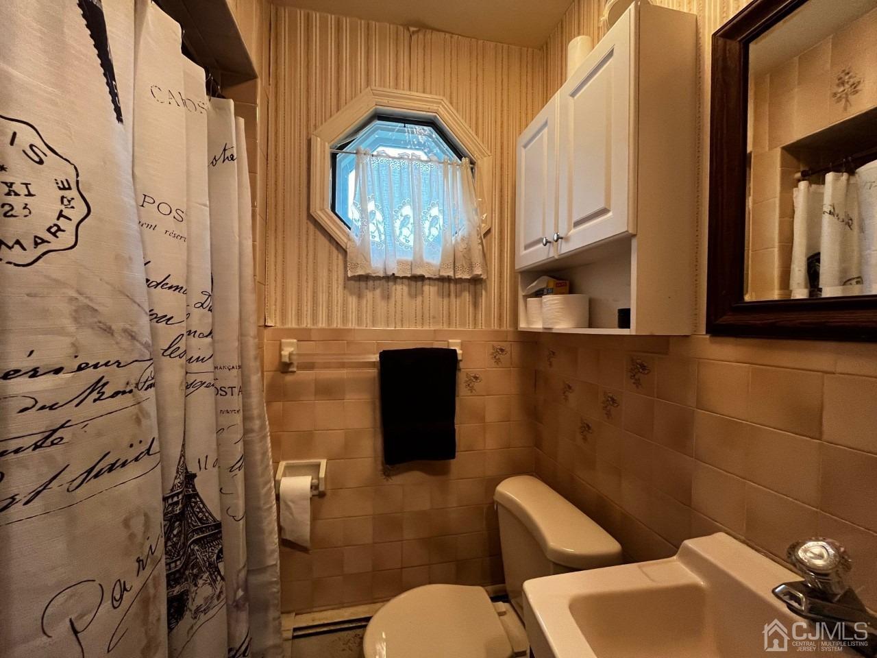 180 Amboy Road Old Bridge, NJ 07747 - Photo 18 of 29 a bathroom with a toilet and a sink