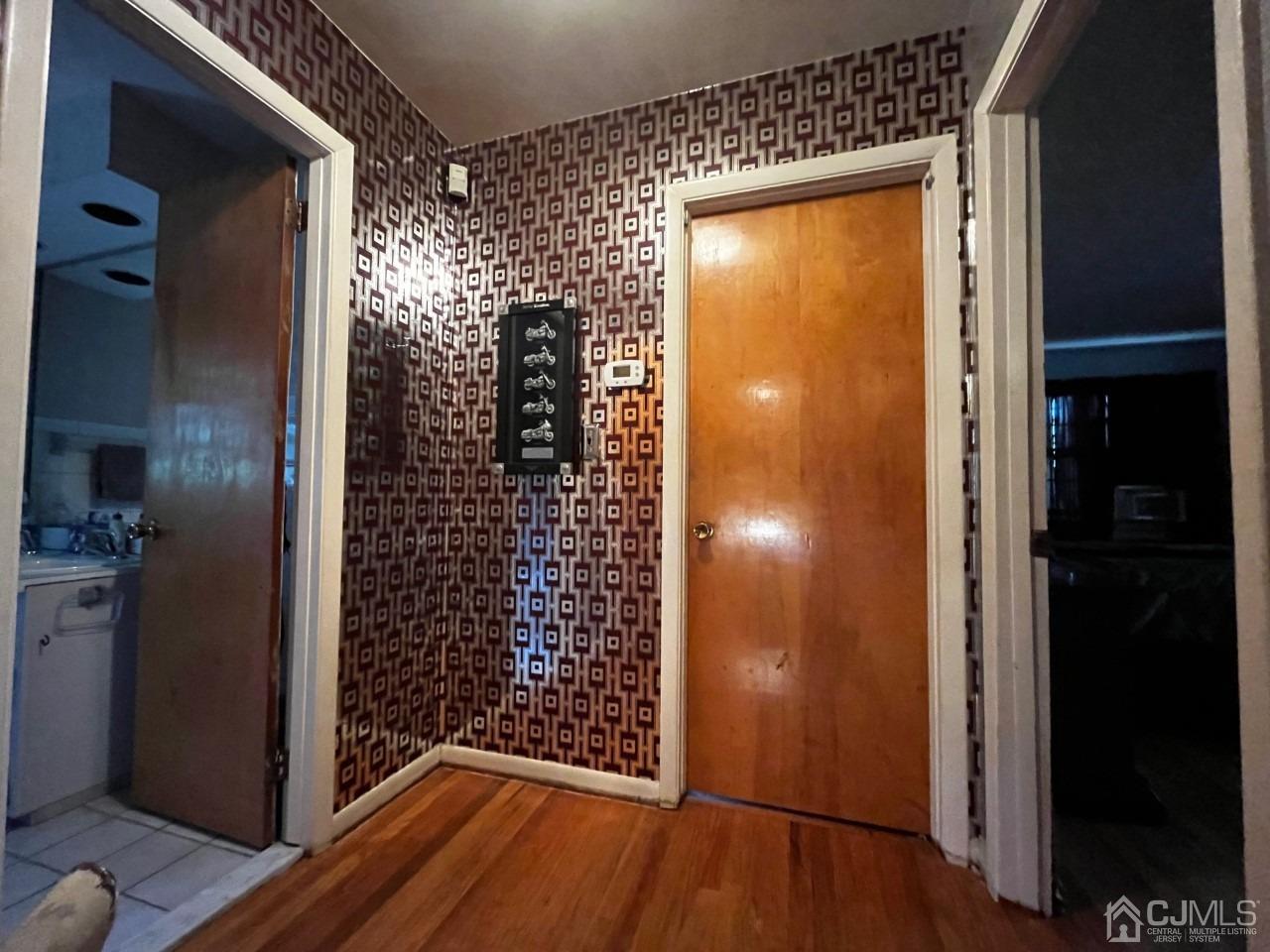 180 Amboy Road Old Bridge, NJ 07747 - Photo 19 of 29 a view of walk in closet with wooden floor