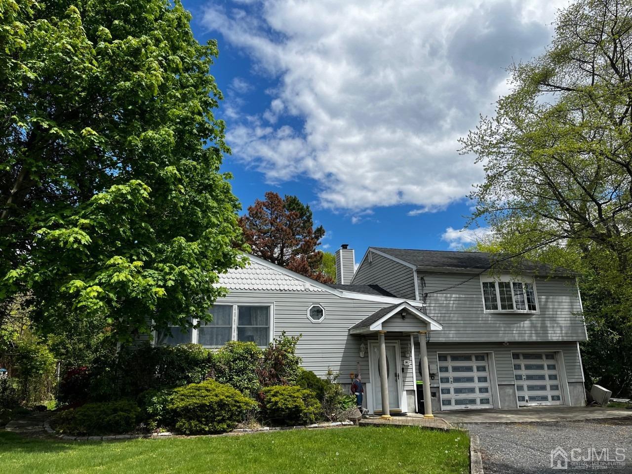 180 Amboy Road Old Bridge, NJ 07747 - Photo 2 of 29 a front view of a house with a yard