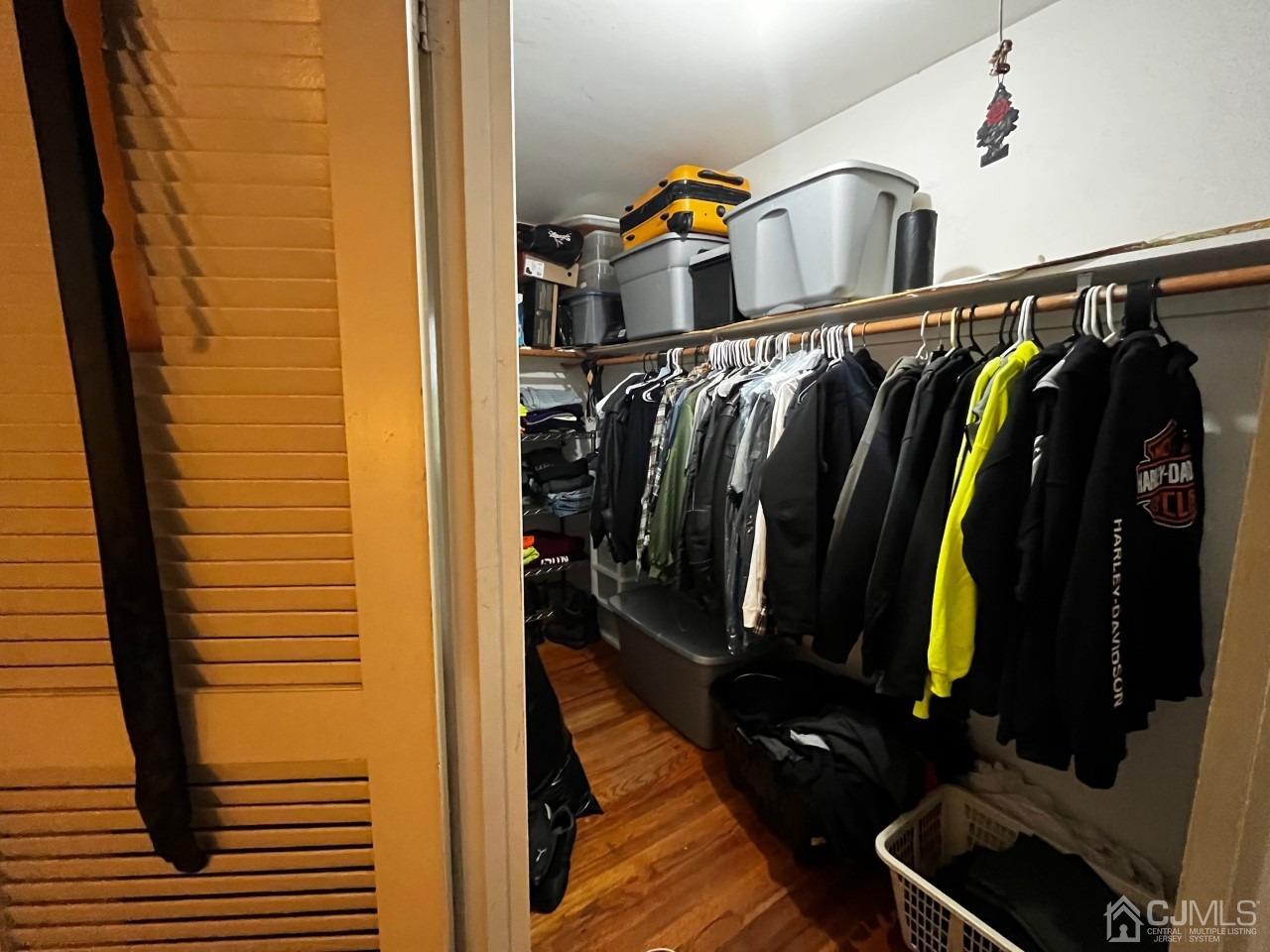180 Amboy Road Old Bridge, NJ 07747 - Photo 22 of 29 a view of walk in closet with clothes and shoes