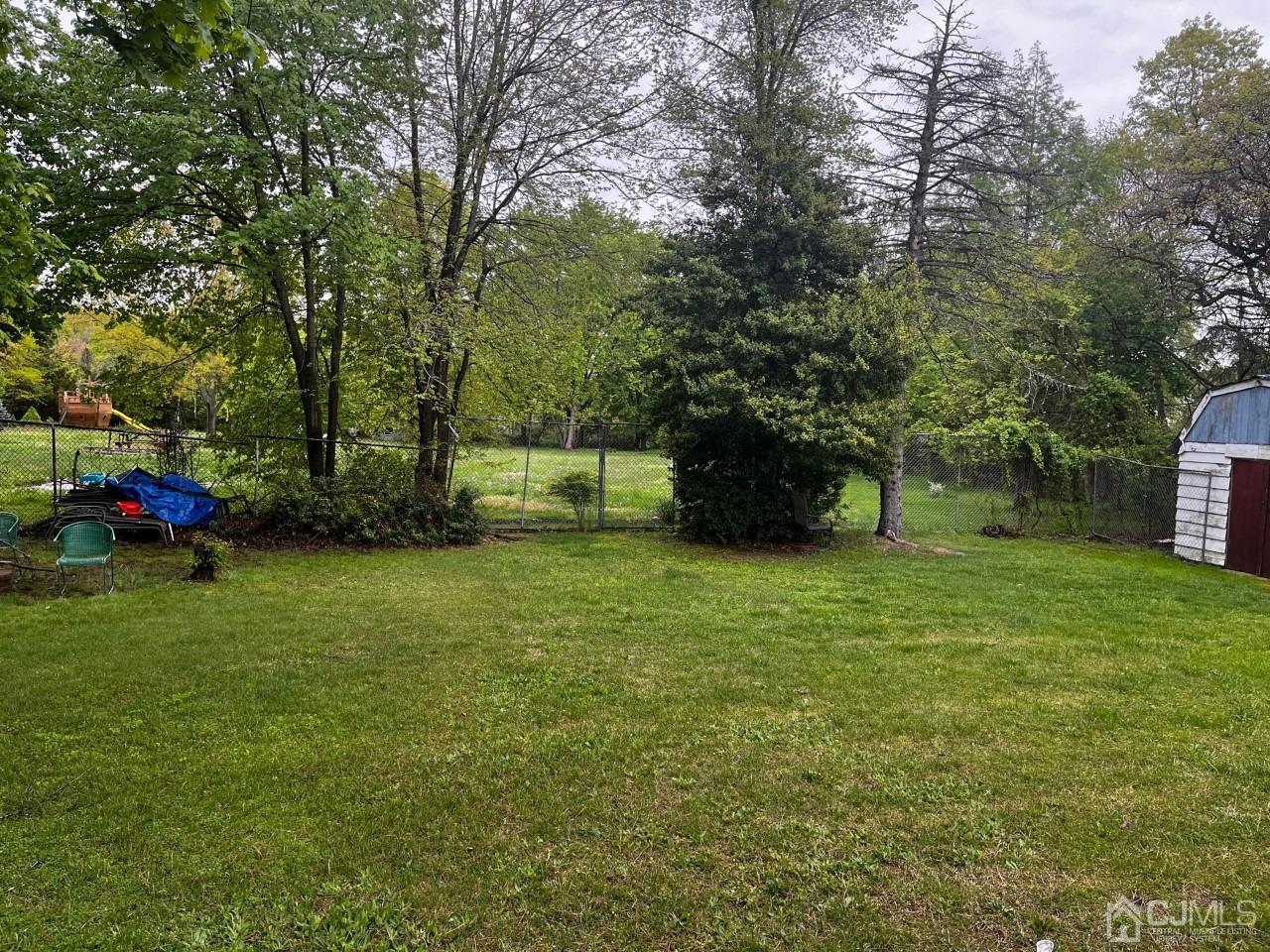 180 Amboy Road Old Bridge, NJ 07747 - Photo 25 of 29 a view of outdoor space with deck and yard
