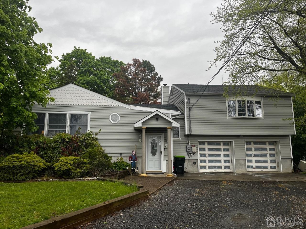180 Amboy Road Old Bridge, NJ 07747 - Photo 28 of 29 a front view of a house with a garden