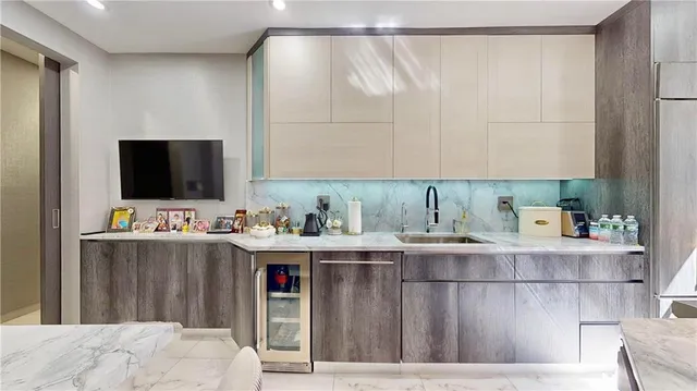 a room with cabinets and flat screen tv